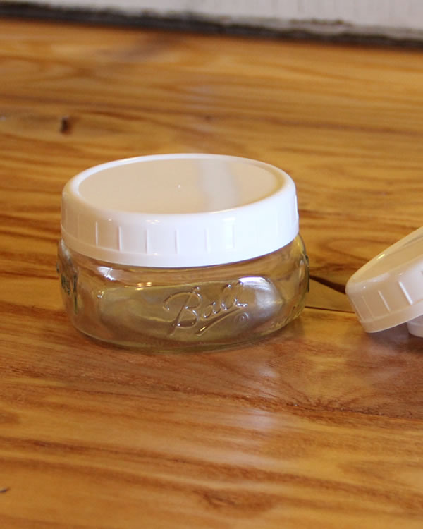 white plastic wide mouth storage cap