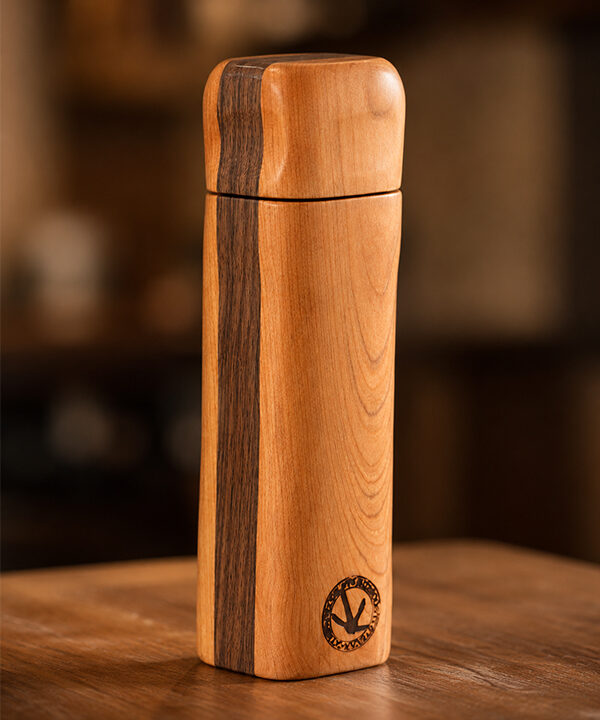 Handcrafted wooden spice grinder with a precision ceramic burr mechanism designed for seeds, spices, and everyday kitchen use.
